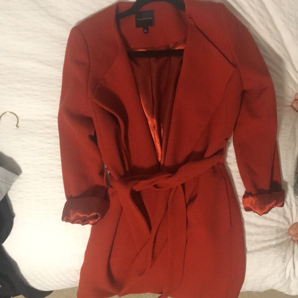 Expensive burnt orange trench coat